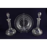A pair of globe and shaft wine decanters, decorated with fruiting vines, 31.5cm high including