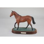 A Royal Doulton porcelain model of racing horse Red Rum, mounted on wooden plinth, 20cm high