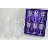 A set of six Edinburgh crystal glasses, boxed, together with a glass vase decorated with fruiting