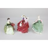 Three Royal Doulton figures of ladies, comprising 'Carolyn', 'Autumn Breezes' and 'Michele', tallest