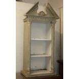 A George III style gilt and grey distressed painted wall shelf with broken arch surmount, three