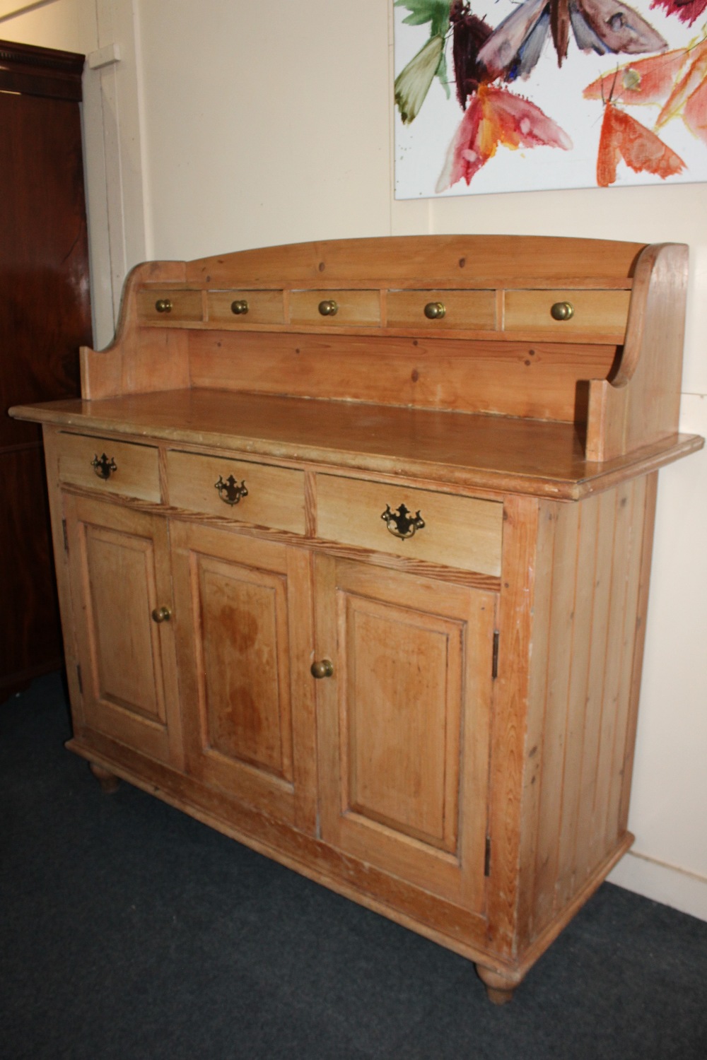 A pine farmhouse kitchen style sideboard, raised shelf back with five drawers, rectangular top