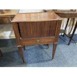 A George III mahogany bedside table with rectangular top, tambour front and drawer on square tapered