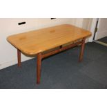 A mid 20th century coffee table, possibly Swedish, the rectangular top with rounded corners, on