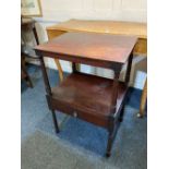 A George III rectangular mahogany two tier occasional table with drawer to base, on turned supports,