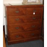 A late 19th century chest of two short over three long drawers with brass drop handles, on plinth