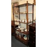 A brass mounted mahogany five tier open shelf unit, with square supports and ball finials, base