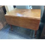 A mahogany Pembroke table, with drawer and opposing dummy drawer, on turned legs and castors, 86.