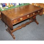 A mahogany sofa table with frieze drawers on shaped end supports with stretcher, 126cm