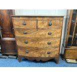 A 19th century mahogany bow front chest of two short over three long drawers, with oval drop handles