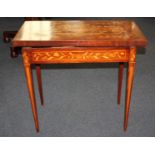 A late 19th/early 20th century Dutch floral marquetry card table rectangular fold over top and
