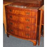 A reproduction mahogany bowfront chest of four graduated drawers, on bracket feet, with makers