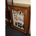 A Victorian walnut pier cabinet single arched glass door enclosing shelves, brass floral mounts,