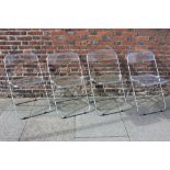 A set of four Castelli perspex and chrome Plia folding chairs, comprising three tinted and one