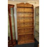 A modern pine waterfall bookcase, with six shelves, on plinth base, 92cm