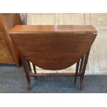 A small drop leaf occasional table with oval top on slatted end supports (a/f top detached) opens to