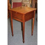 An Edwardian inlaid mahogany sewing work table, with rising top, enclosing fabric lined compartment,