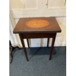 An Edwardian inlaid mahogany rectangular card table the top with central inlaid oval panel of