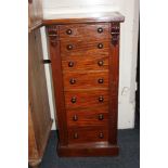 A mahogany Wellington chest of seven graduating drawers with knob handles, locking bar (lacks key)