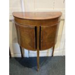 An Edwardian inlaid mahogany demi-lune side cabinet the top with fan design, two cupboards on square