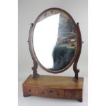 A George III mahogany dressing table mirror, oval glass on box base with three drawers (a/f-