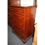 An Edwardian inlaid mahogany tall chest, of five drawers, with cross banded and striped line inlay