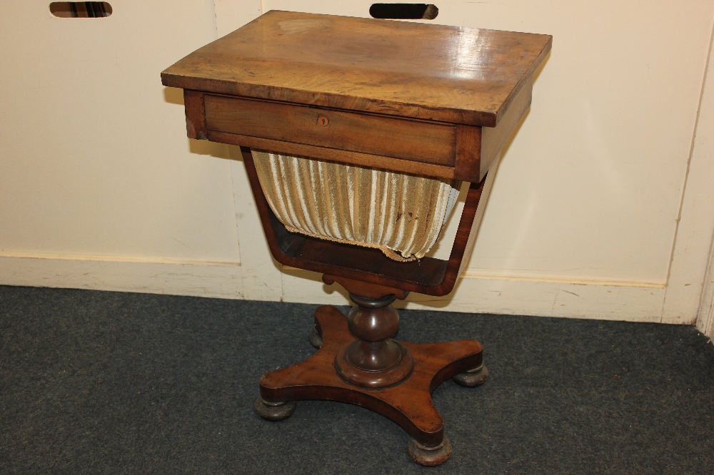 A Victorian sewing table, with fitted drawer and pull-out silks drawer, with turned