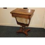 A Victorian sewing table, with fitted drawer and pull-out silks drawer, with turned