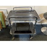 A modernist chrome and glass two-tier tea trolley on castors, 62cm