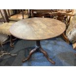 A George III oak circular tea table on column support and tripod base, 82cm