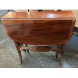 An Edwardian mahogany drop leaf Sutherland table with crossbanded rectangular top, pierced end