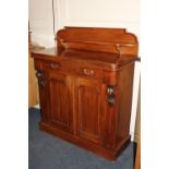 A Victorian mahogany chiffonier, with raised back and shelf, over a single drawer and two panel