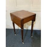 A 19th century mahogany drop flap occasional table, with single drawer on turned tapered legs and