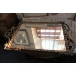 A giltwood and gesso rectangular wall mirror, with scroll surmount and festoon base, glass 77cm by