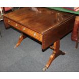 A reproduction mahogany sofa table with line inlay, two drawers, opposing dummy drawers, shaped