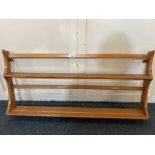 An Ercol wall hanging plate rack, with two shelves, 96cm