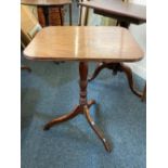 A George III mahogany occasional table with rectangular tilt top on baluster support and tripod