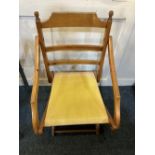 An early 20th century folding deck / travel chair with canvas seat