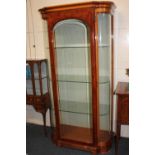 A reproduction display cabinet, with burr wood and floral decorated glazed panel door and bowed