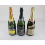 A bottle of Chanoine 1998 vintage champagne, a bottle of Charles Heidsieck champagne and a bottle of