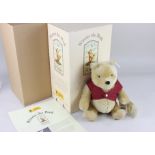 A Steiff limited edition mohair Winnie the Pooh, with ear button, 27cm high, boxed with paperwork