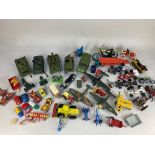 A collection of Dinky die-cast model military vehicles, including aircraft 'Junkers JU87B' and '