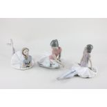 Three Lladro porcelain models of ballerinas in various poses, tallest 17cm high