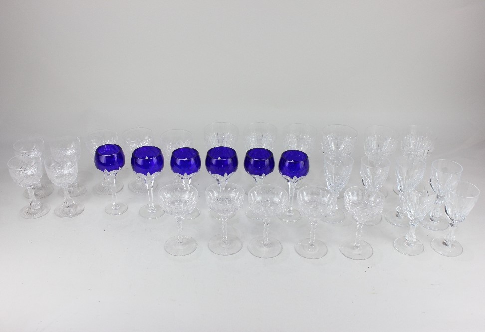 A collection of cut glass wine and other drinking glasses, to include a set of six blue and clear