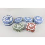A collection of six Wedgwood Jasperware lidded trinket pots, assorted shapes and colour ways,