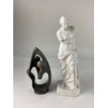 A R & L parian figure of the Venus De Milo 34cm high, and a modernist carved stone figure group of a