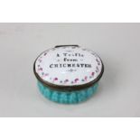 A 19th century oval enamel pill box the lid inscribed "A Trifle from Chichester', 4cm