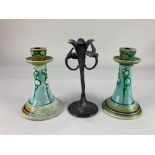 A pair of Art Nouveau Minton Ltd pottery candlesticks, (a/f- restored), and an Art Nouveau pewter