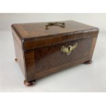 A George III burrwood and cross banded tea caddy, rectangular shape with brass handles and