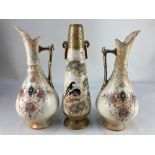 A pair of Victorian porcelain ewers, with floral design on cream ground, with gilt embellishments,